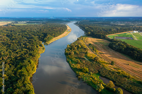 Fototapeta Naklejka Na Ścianę i Meble -  Summer landscape. A meandering river flows through trees and fields