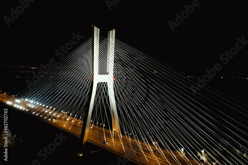 Redzin Bridge in Wroclaw at dusk, Beautifully lit by white lamps, Pole pylons photo