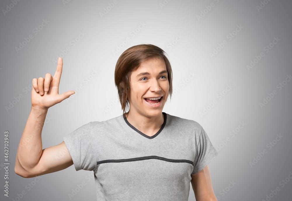Portrait of an excited man smiling and looking at the camera Portrait of an excited man smiling and looking at the camera