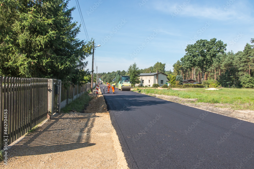 Construction of a country street with an asphalt surface Construction of a country street with an asphalt surface