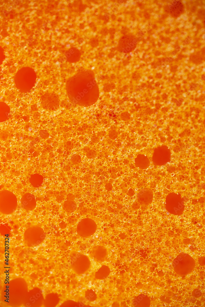 Yellow foam rubber texture, synthetic sponge close-up Yellow foam rubber texture, synthetic sponge close-up
