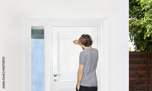 Man opening the door of her home.Inviting the guests.