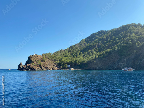 Big beautiful tropical paradise island with mountains, plants and trees green and blue salty warm sea