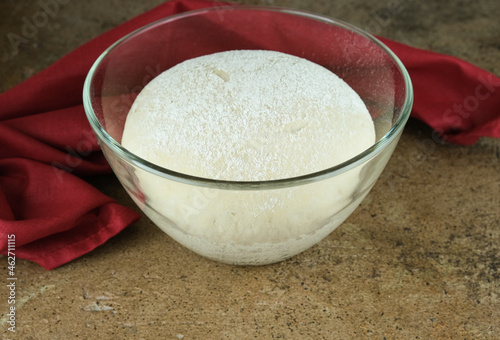 Bread sourdough in glass containers, opara, lush yeast dough, red-brown background. Clouse-up.