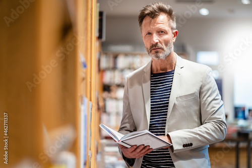 Portrait of mature man in a bookshop