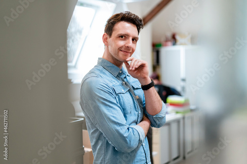 Portrait of smiling young businessman in office