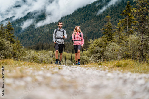 Young couple on a hiking trip, Vorderriss, Bavaria, Germany