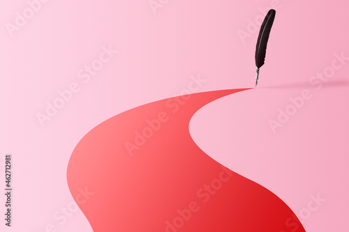 Quill pen leaving a colorful trace over pink background photo