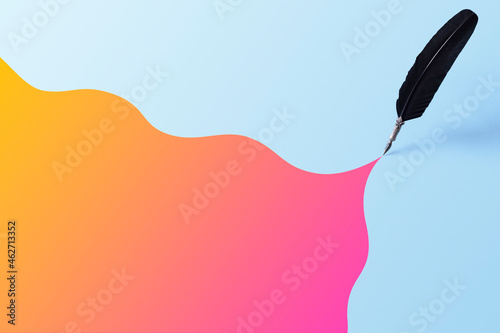 Quill pen leaving a colorful trace over blue background