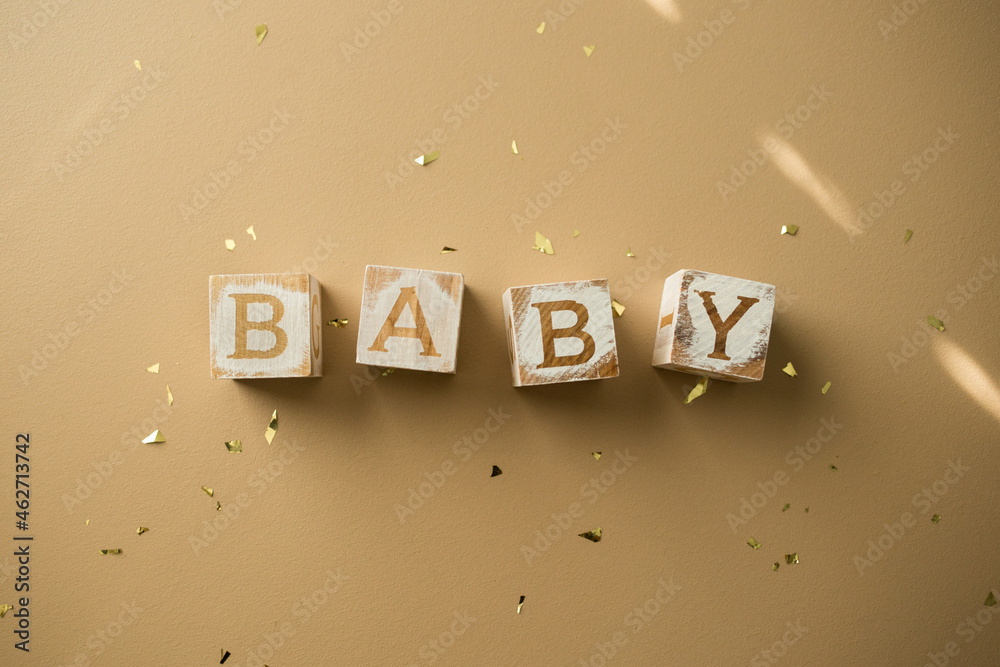 Wooden Baby Blocks on Background with Confetti Stock Photo