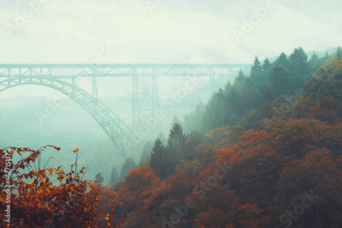 Bridge and fog in autumn photo