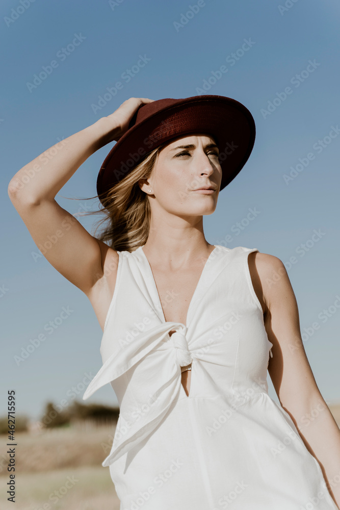 Portrait of female traveller with straw hat Portrait of female traveller with straw hat