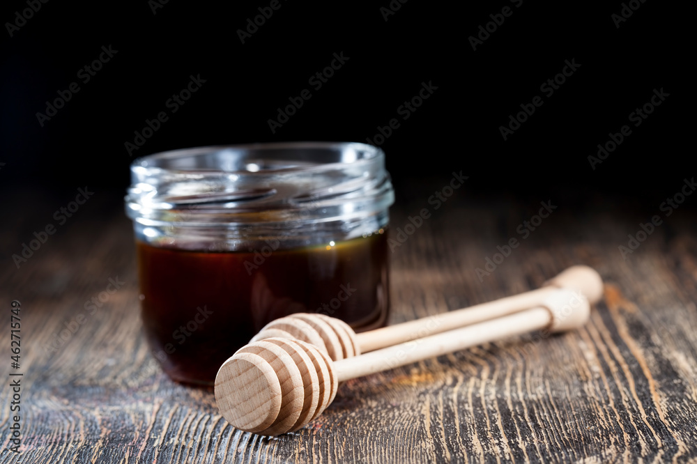 old table on which there is a healthy and sweet bee honey old table on which there is a healthy and sweet bee honey