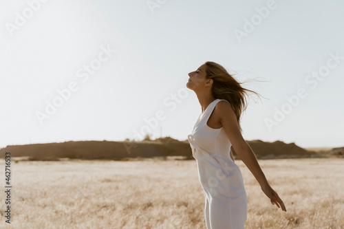 Female traveller enjoying the wind photo