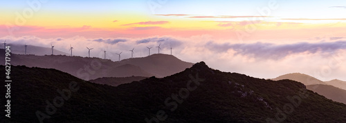 Gibraltar, Wind turbines in landscape at sunset