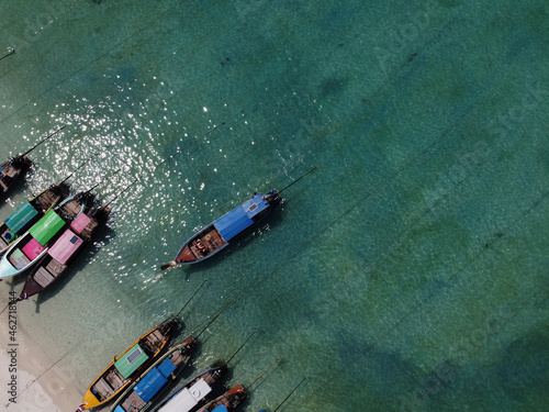 Traditional wooden boats at the beach, Ko Phi Phi Don, Thailand photo