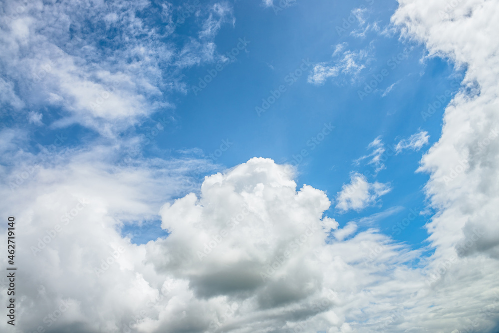 Obraz premium Scenic nature landscape with beautiful cirrus clouds in blue sky. Colorful cloudscape with spindrift clouds in blue sky. Nature background of sky with cirrostratus clouds. Natural cloudy sky backdrop.