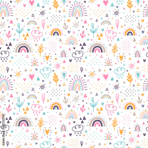 Hand drawn seamless pattern. Childish background with rainbows. Nursery design for kids. Trendy texture for fabric, textile, cloth, wrapping paper
