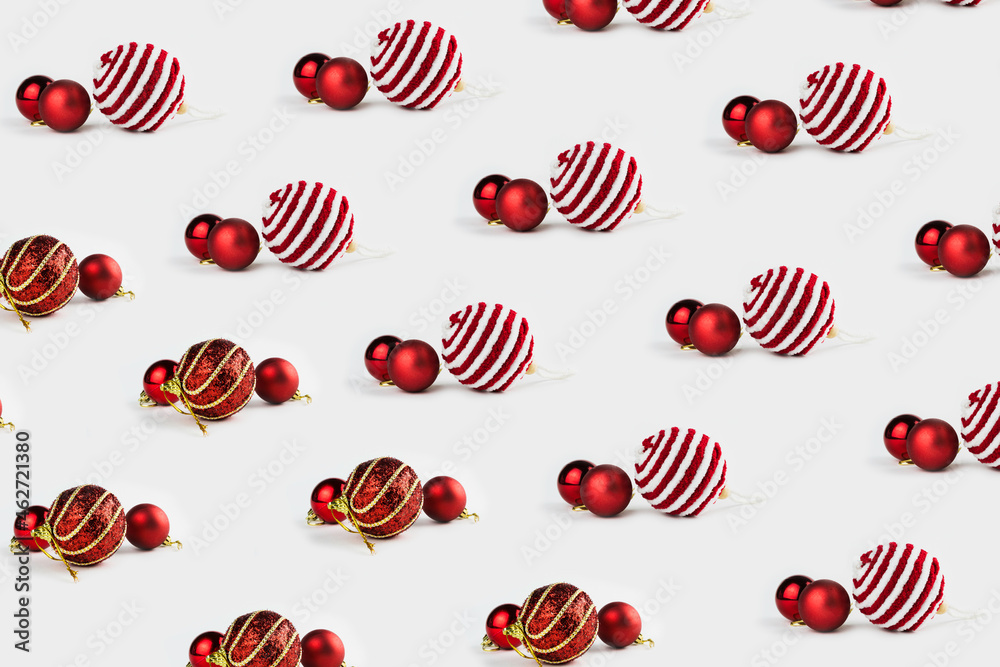 Pattern with Christmas ornaments including balls on white background. Pattern with Christmas ornaments including balls on white background.