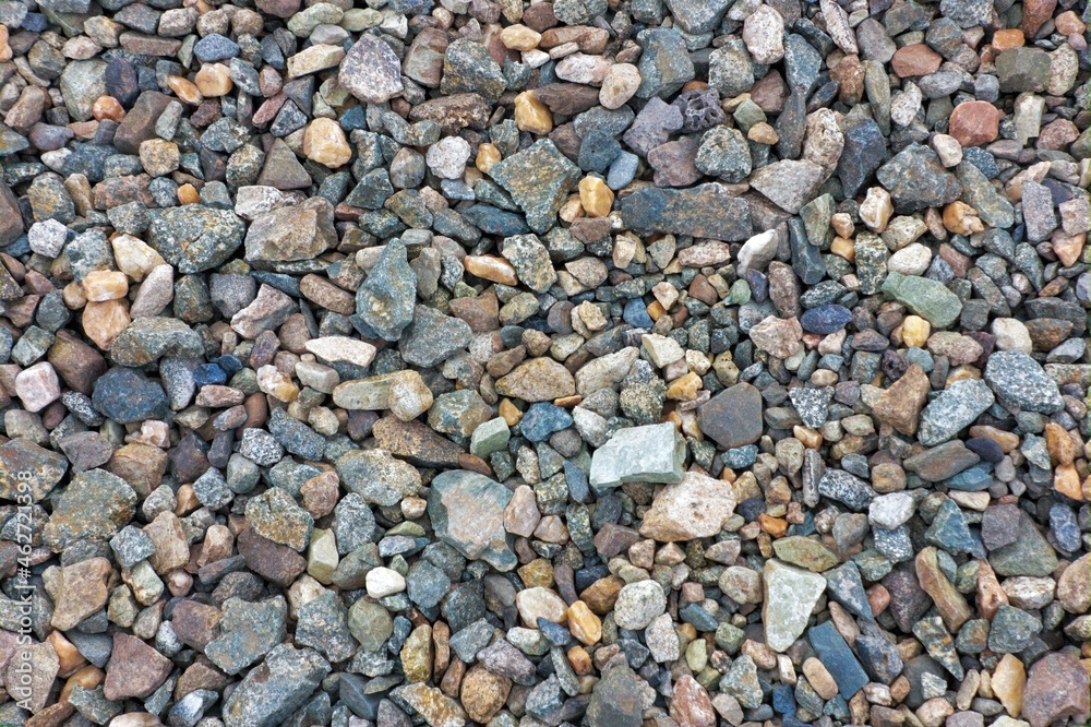 Crushed granite texture close-up. Background made of a closeup of a pile of crushed stone. Crushed granite texture close-up. Background made of a closeup of a pile of crushed stone.