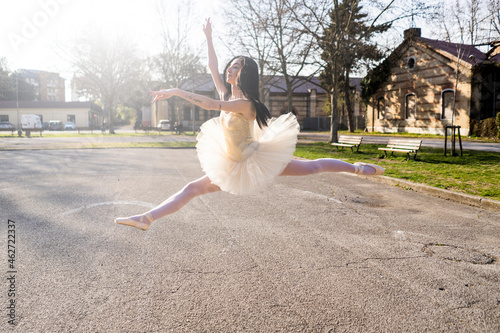 Italy, Verona, Ballerina dancing in the city jumping midair photo