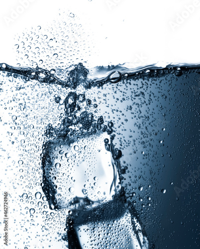 Ice cubes inside glass of carbonated water photo