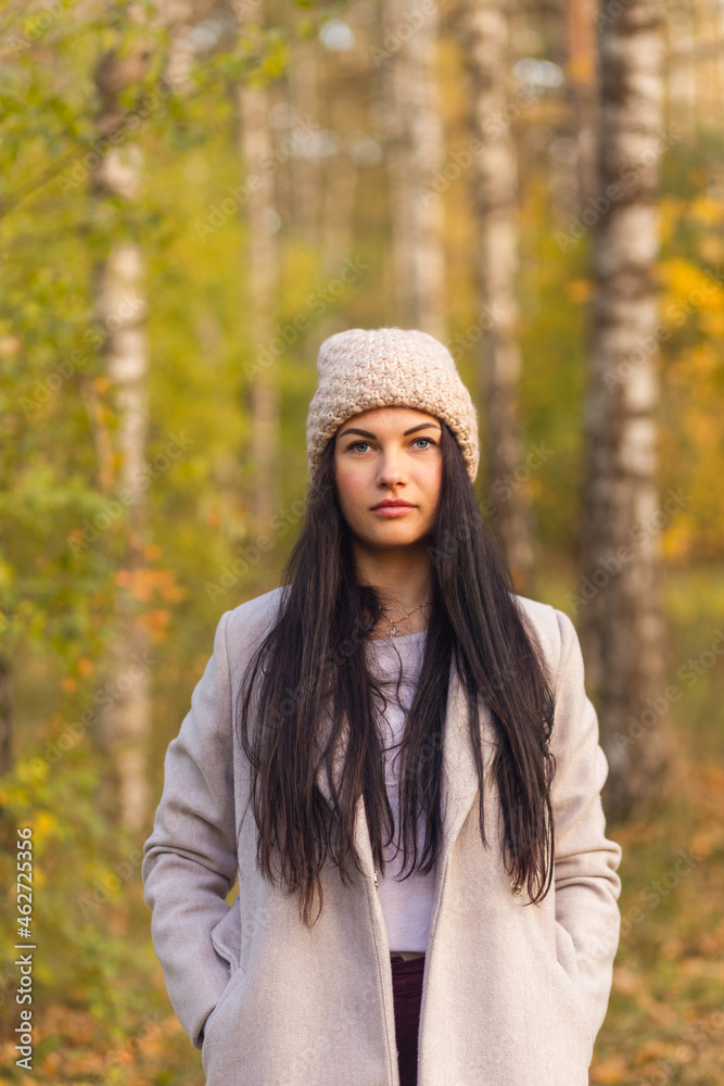 Portrait of a joyful young woman enjoying in the autumn park. Portrait of a joyful young woman enjoying in the autumn park.