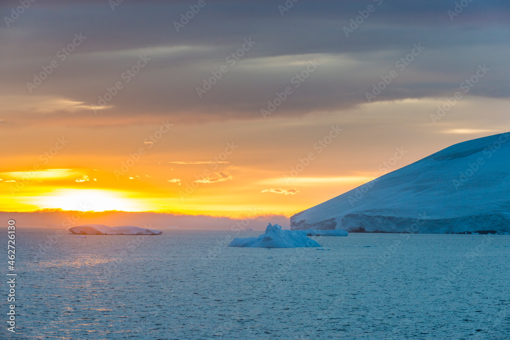 Antarctic coastline at cloudy sunset Antarctic coastline at cloudy sunset