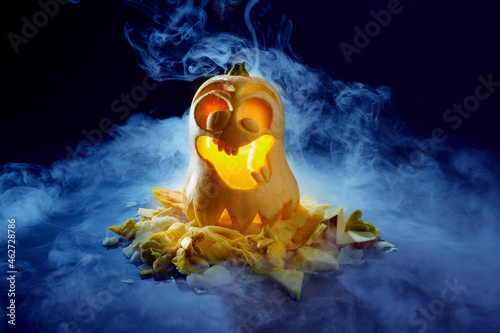 Studio shot of spooky jack-o-lantern made ofÔøΩbutternut squash