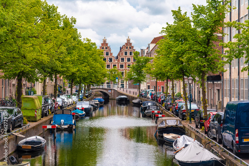 Netherlands, North Holland, Haarlem, Boats moored along city canal photo