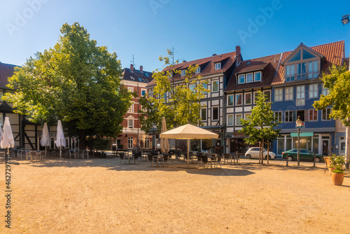Germany, Lower Saxony, Brunswick, Historic half timbered houses surrounding empty square in Magniviertel quarter photo