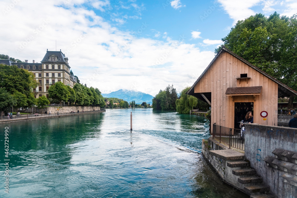 Aare river flowing against cloudy sky in Thun at Switzerland Aare river flowing against cloudy sky in Thun at Switzerland