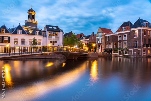 Netherlands, South Holland, Leiden, Catharinabrug stretching over Oude Rijn canal at dusk photo
