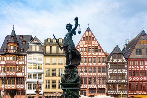 Germany, Frankfurt, Roemerberg, Fountain of Justice on old town square with half timbered houses photo