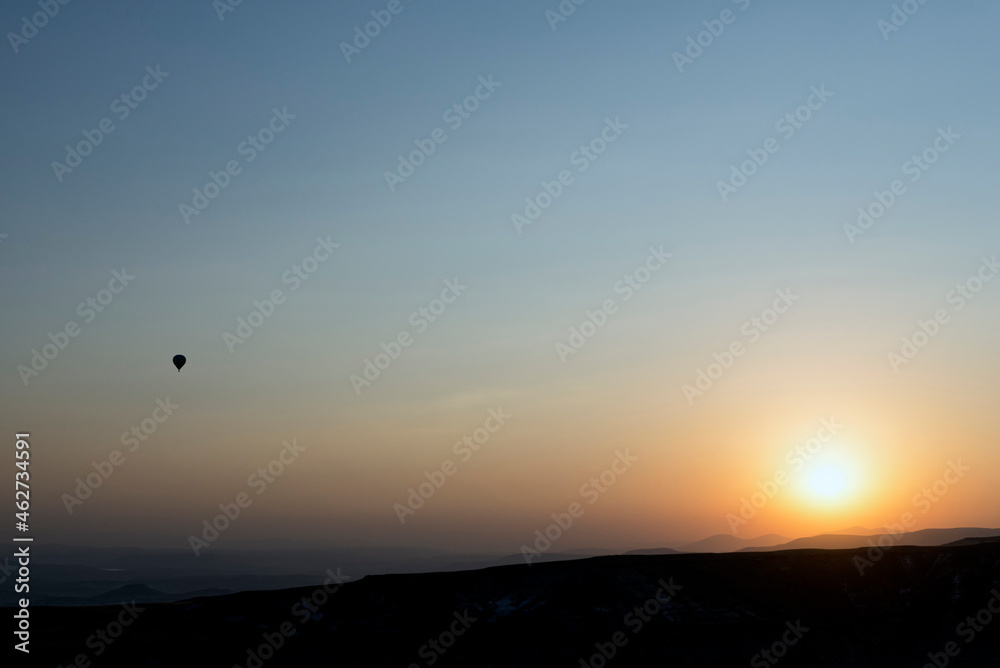 Hot air balloon flight during sunrise