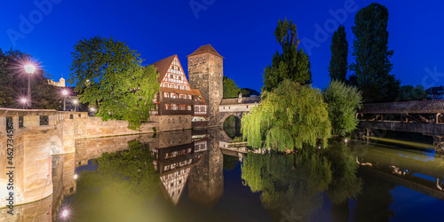 Germany, Bavaria, Nuremberg, Panorama of river Pegnitz, Weinstadel and Wasserturm at night