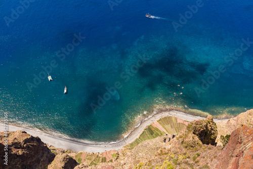 Portugal, Winding road stretching along shore of Madeira Island seen from top of Cabo Girao cliff photo