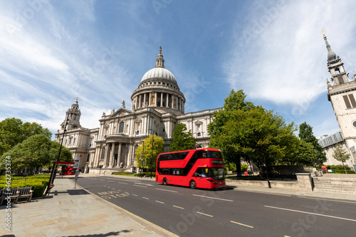 UK, London, St Paul's Cathedral and  red double decker bus on a sunny day photo