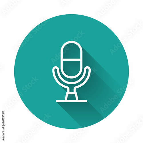 White line Microphone voice device icon isolated with long shadow background. Microphone interpreter and alphabet letters. Green circle button. Vector