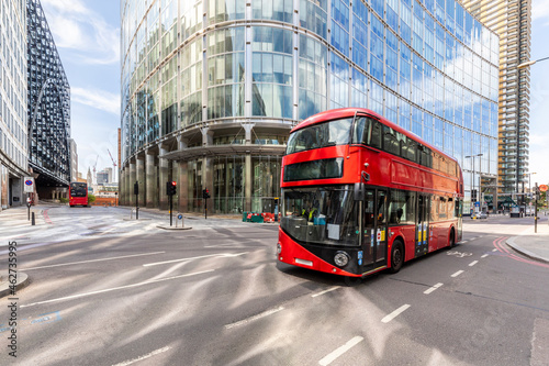 UK, London, Red double decker bus # with modern buildings in background photo