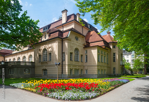 Germany, Bavaria, Bad Reichenhall, Colorful flowerbed in front of spa in Royal Spa Garden photo