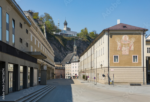 Austria, Salzburg, Hofstallgasse with Great Festival Hall and Burgerspitalskirche St. Blasius, empty due to Coronavirus pandemic photo