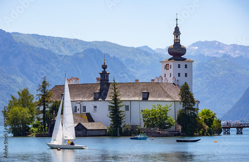 Sailing boat in lake by Schloss Ort castle, Salzkammergut, Gmunden, Traunsee, Upper Austria, Austria