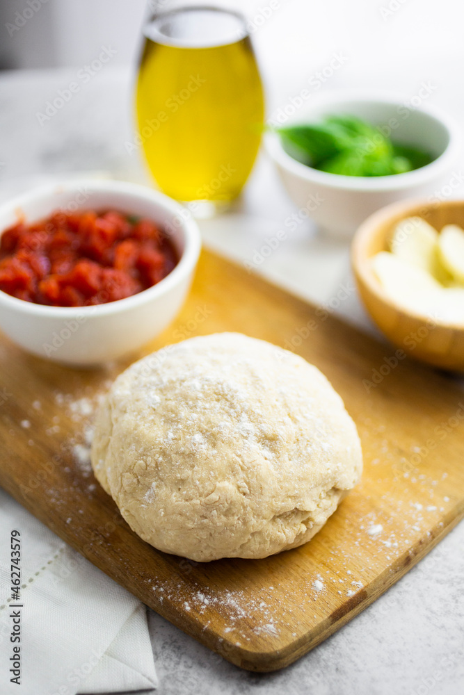Raw dough for makingÔøΩMargharitaÔøΩpizza Raw dough for makingÔøΩMargharitaÔøΩpizza