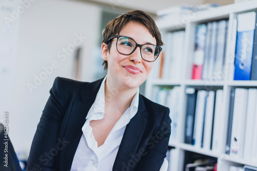 Portait of smiling young businesswoman in office photo