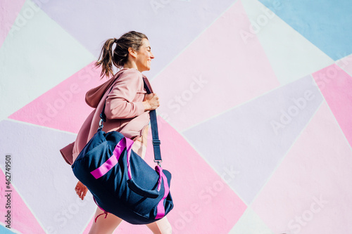 Sportive woman with sports bag photo