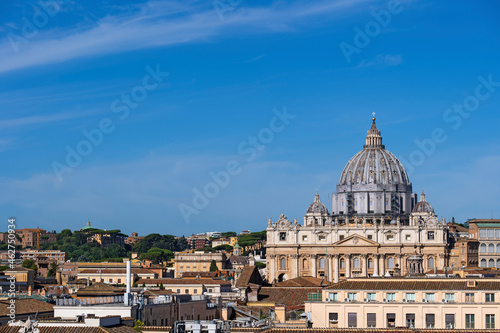 St. Peter's Basilica in Vatican City against blue sky on sunny day