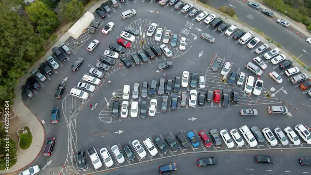 Aerial view above the parking lot to the Griffith Observatory, full of cars in Los Angeles - top down, drone shot Aerial view above the parking lot to the Griffith Observatory, full of cars in Los Angeles - top down, drone shot
