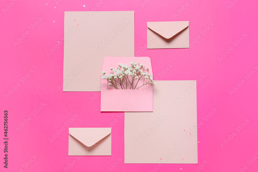 Blank cards with envelopes and flowers on pink background Blank cards with envelopes and flowers on pink background