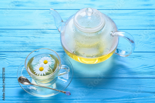 Chamomile tea in glass teap...